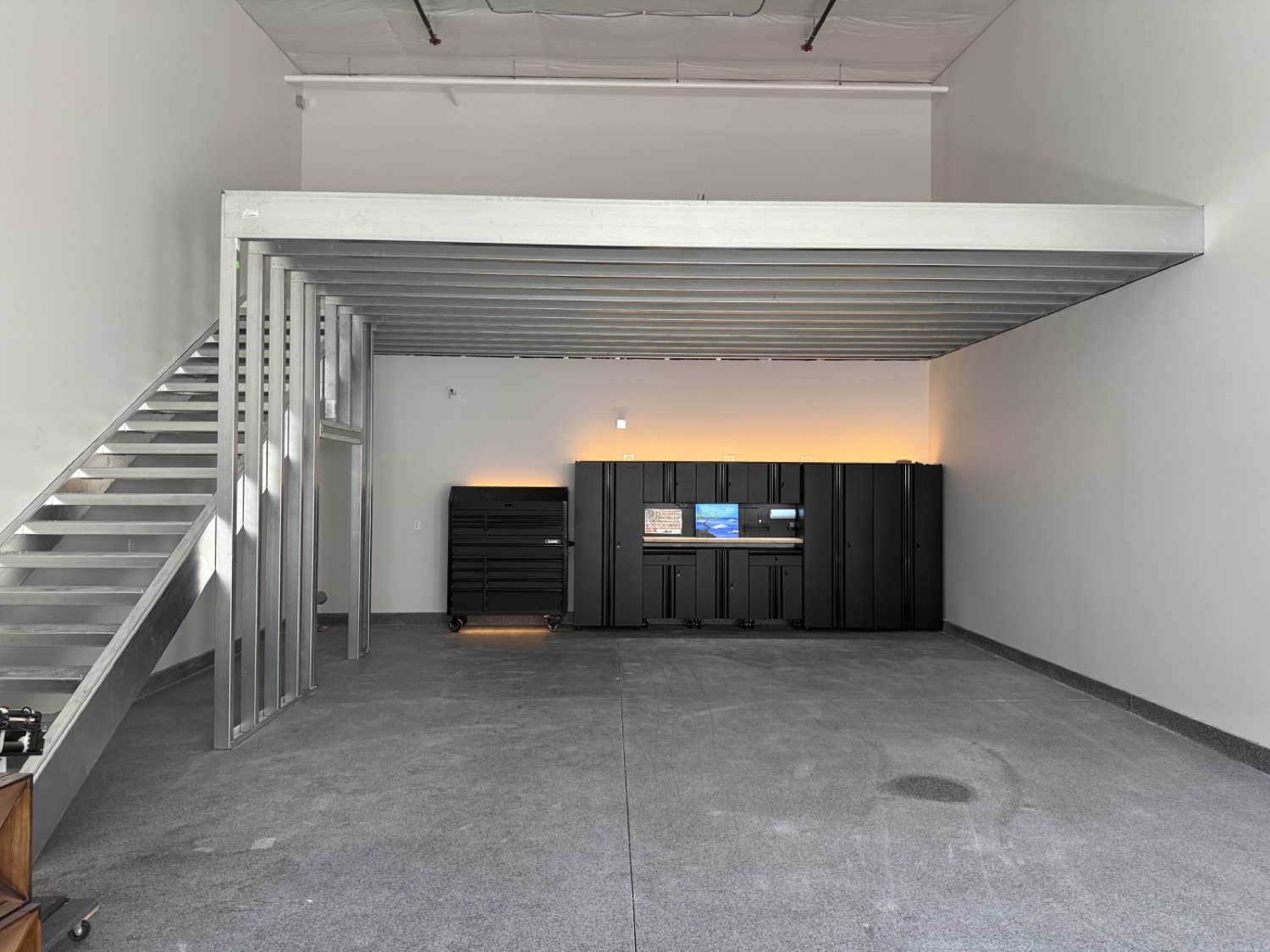 Mezzanine above a workshop and cabinetry area